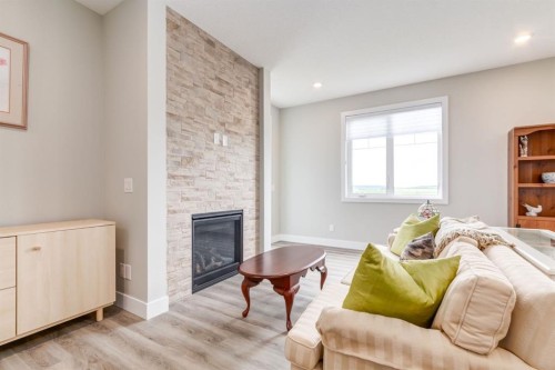 220-20 Silverado Crest Park Sw, Calgary, AB - Indoor Photo Showing Other Room With Fireplace