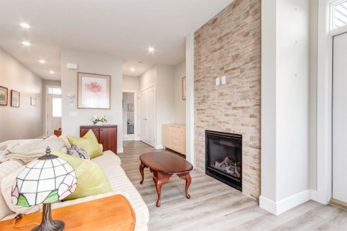 220-20 Silverado Crest Park Sw, Calgary, AB - Indoor With Fireplace