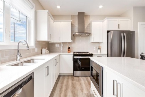 220-20 Silverado Crest Park Sw, Calgary, AB - Indoor Photo Showing Kitchen With Double Sink With Upgraded Kitchen