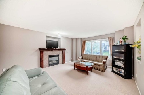 135 Copperstone Grove Se, Calgary, AB - Indoor Photo Showing Living Room With Fireplace