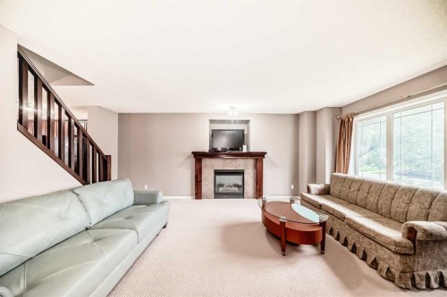 135 Copperstone Grove Se, Calgary, AB - Indoor Photo Showing Living Room With Fireplace