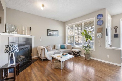 57 Auburn Bay View Se, Calgary, AB - Indoor Photo Showing Living Room With Fireplace