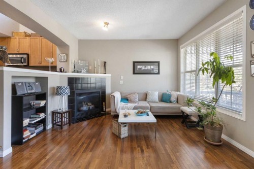 57 Auburn Bay View Se, Calgary, AB - Indoor Photo Showing Living Room With Fireplace