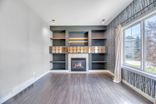 420 Ranch Ridge Meadow, Strathmore, AB - Indoor Photo Showing Other Room With Fireplace