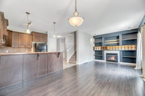 420 Ranch Ridge Meadow, Strathmore, AB - Indoor Photo Showing Kitchen With Fireplace