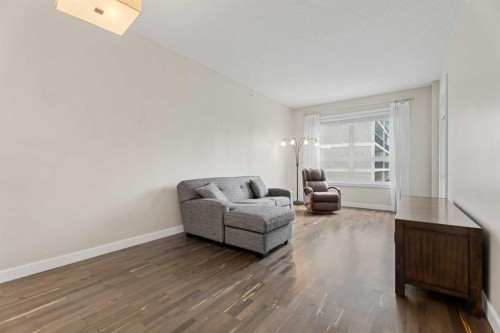 308-1110 3 Avenue Nw, Calgary, AB - Indoor Photo Showing Living Room