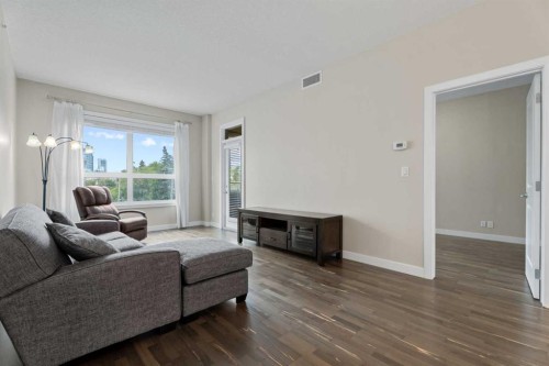 308-1110 3 Avenue Nw, Calgary, AB - Indoor Photo Showing Living Room