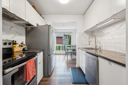 41-6915 Ranchview Drive Nw, Calgary, AB - Indoor Photo Showing Kitchen With Double Sink With Upgraded Kitchen
