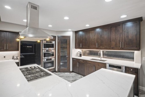 42 Woodhaven Crescent Sw, Calgary, AB - Indoor Photo Showing Kitchen With Double Sink