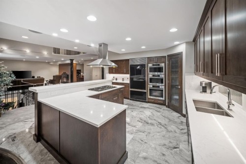 42 Woodhaven Crescent Sw, Calgary, AB - Indoor Photo Showing Kitchen With Double Sink