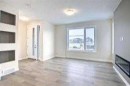 117 Cobblestone Gate Sw, Airdrie, AB  - Indoor With Fireplace 