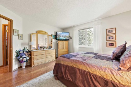 217 Arbour Cliff Close Nw, Calgary, AB - Indoor Photo Showing Bedroom