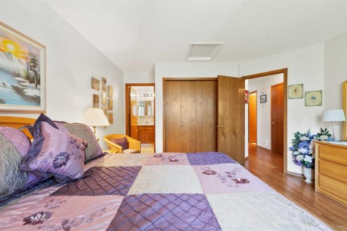 217 Arbour Cliff Close Nw, Calgary, AB - Indoor Photo Showing Bedroom