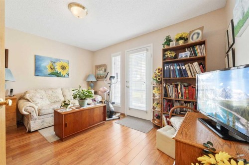 217 Arbour Cliff Close Nw, Calgary, AB - Indoor Photo Showing Living Room
