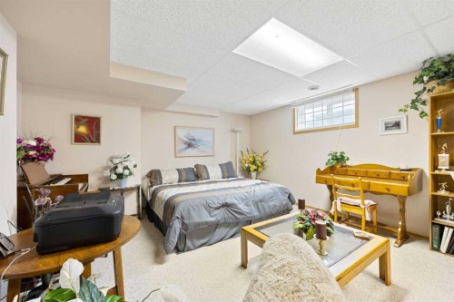 217 Arbour Cliff Close Nw, Calgary, AB - Indoor Photo Showing Bedroom