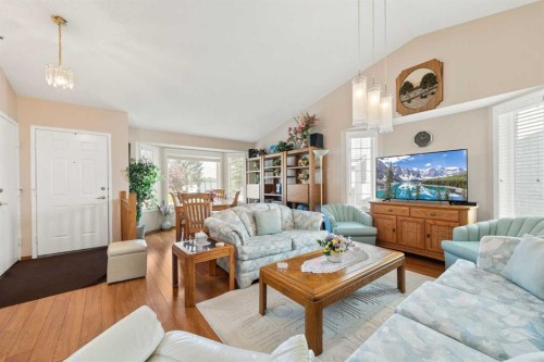 217 Arbour Cliff Close Nw, Calgary, AB - Indoor Photo Showing Living Room