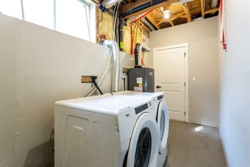 125 Martinpark Way Ne, Calgary, AB - Indoor Photo Showing Laundry Room