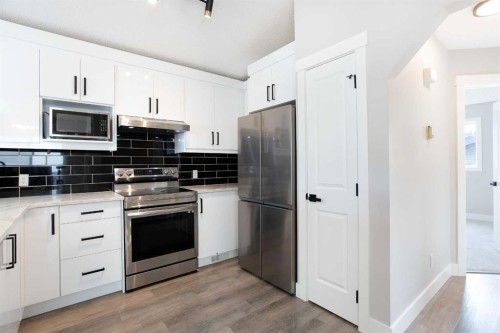 125 Martinpark Way Ne, Calgary, AB - Indoor Photo Showing Kitchen With Stainless Steel Kitchen
