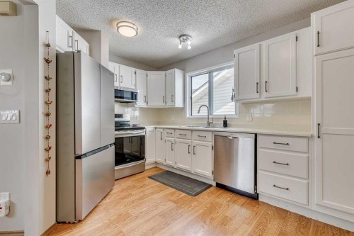 24 Millcrest Road Sw, Calgary, AB - Indoor Photo Showing Kitchen With Stainless Steel Kitchen