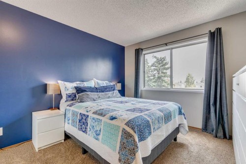 24 Millcrest Road Sw, Calgary, AB - Indoor Photo Showing Bedroom