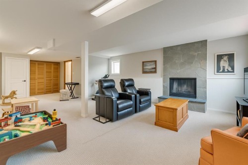 24 Millcrest Road Sw, Calgary, AB - Indoor With Fireplace