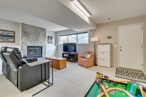 24 Millcrest Road Sw, Calgary, AB - Indoor With Fireplace