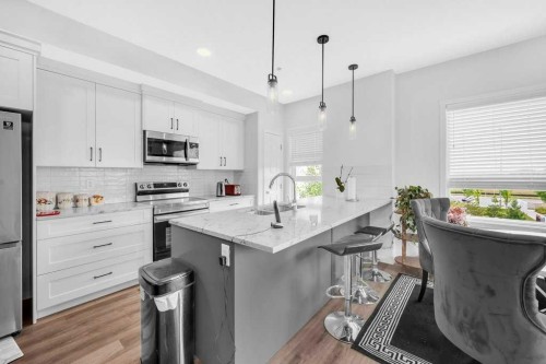 1211-19489 Main Street Se, Calgary, AB - Indoor Photo Showing Kitchen With Stainless Steel Kitchen With Upgraded Kitchen