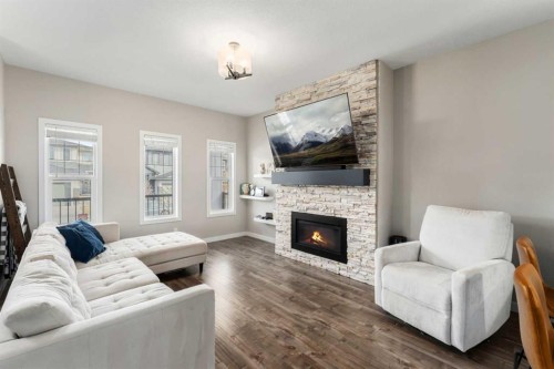 228 Ravenstern Crescent Se, Airdrie, AB - Indoor Photo Showing Living Room With Fireplace