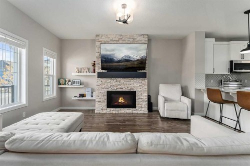 228 Ravenstern Crescent Se, Airdrie, AB - Indoor Photo Showing Living Room With Fireplace