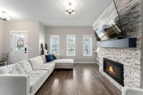 228 Ravenstern Crescent Se, Airdrie, AB - Indoor Photo Showing Living Room With Fireplace