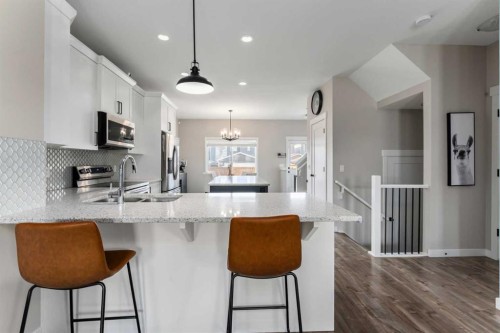 228 Ravenstern Crescent Se, Airdrie, AB - Indoor Photo Showing Kitchen With Double Sink With Upgraded Kitchen