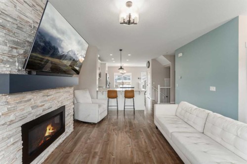 228 Ravenstern Crescent Se, Airdrie, AB - Indoor Photo Showing Living Room With Fireplace