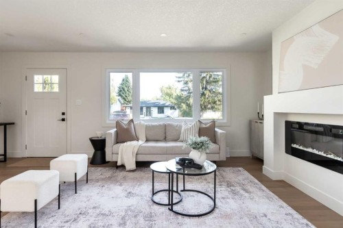 15 Hoover Place Sw, Calgary, AB - Indoor Photo Showing Living Room With Fireplace