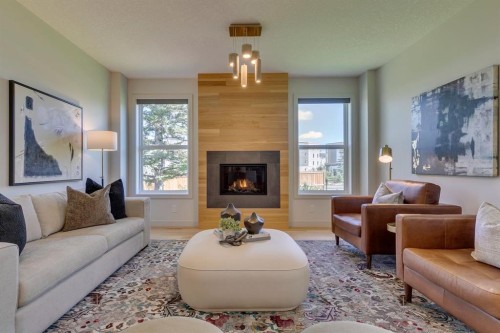 69 Shawnee Green Sw, Calgary, AB - Indoor Photo Showing Living Room With Fireplace