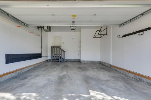 69 Shawnee Green Sw, Calgary, AB - Indoor Photo Showing Garage