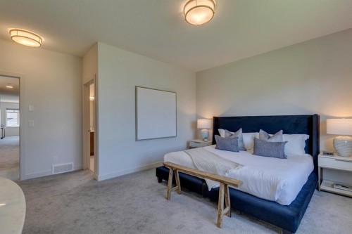 69 Shawnee Green Sw, Calgary, AB - Indoor Photo Showing Bedroom
