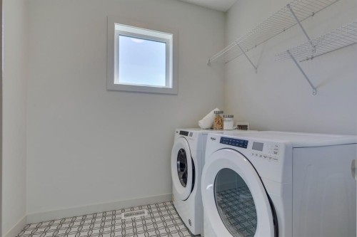 69 Shawnee Green Sw, Calgary, AB - Indoor Photo Showing Laundry Room
