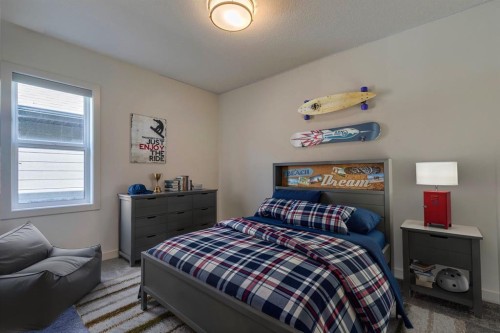 69 Shawnee Green Sw, Calgary, AB - Indoor Photo Showing Bedroom