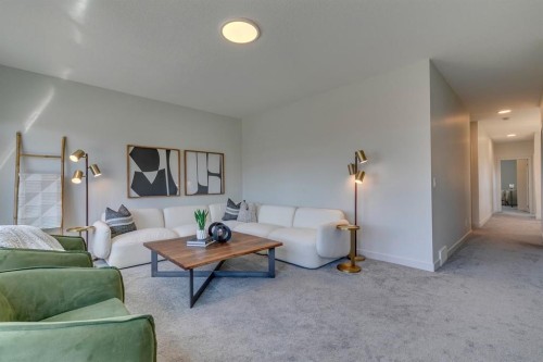 69 Shawnee Green Sw, Calgary, AB - Indoor Photo Showing Living Room