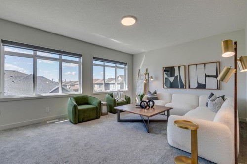 69 Shawnee Green Sw, Calgary, AB - Indoor Photo Showing Living Room
