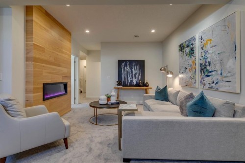 69 Shawnee Green Sw, Calgary, AB - Indoor Photo Showing Living Room With Fireplace