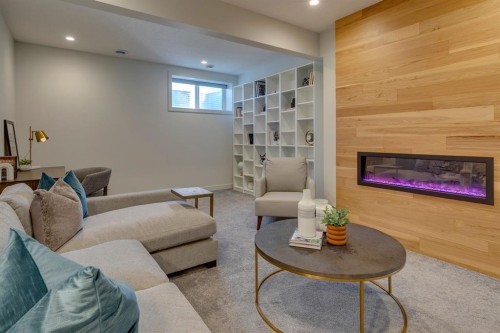 69 Shawnee Green Sw, Calgary, AB - Indoor Photo Showing Living Room With Fireplace