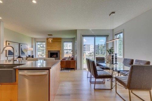 69 Shawnee Green Sw, Calgary, AB - Indoor With Fireplace