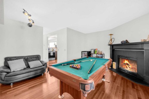 252 21 Avenue Ne, Calgary, AB - Indoor Photo Showing Other Room With Fireplace