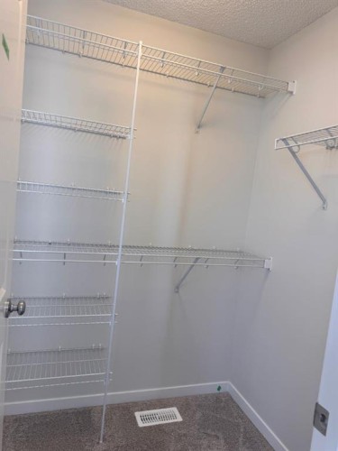 25 Setonvista Gate Se, Calgary, AB - Indoor With Storage