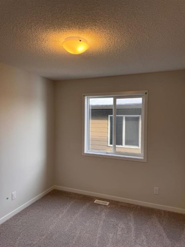 25 Setonvista Gate Se, Calgary, AB - Indoor Photo Showing Other Room
