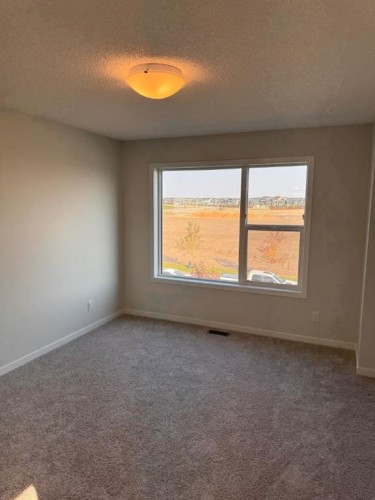 25 Setonvista Gate Se, Calgary, AB - Indoor Photo Showing Other Room