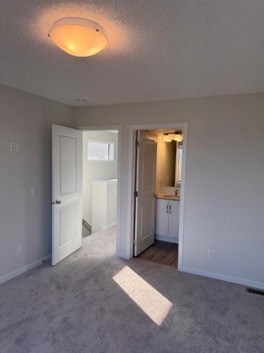 25 Setonvista Gate Se, Calgary, AB - Indoor Photo Showing Other Room