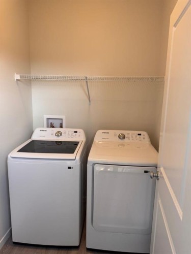 25 Setonvista Gate Se, Calgary, AB - Indoor Photo Showing Laundry Room