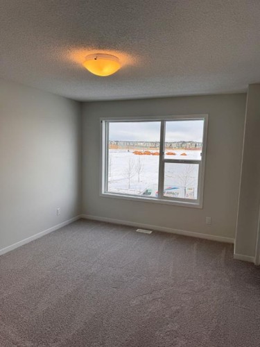 25 Setonvista Gate Se, Calgary, AB - Indoor Photo Showing Other Room